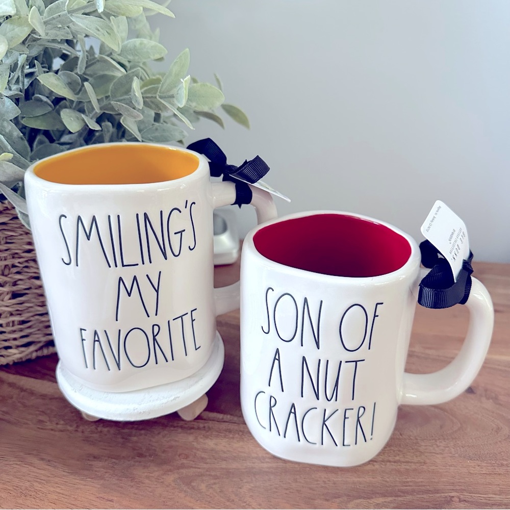 2 Rae Dunn Double Sided Elf Mugs, Smiling’s My Favorite & Son Of A Nut Cracker